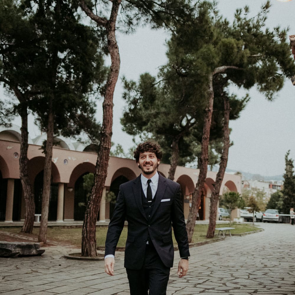 The groom arriving to their Greek church wedding ceremony