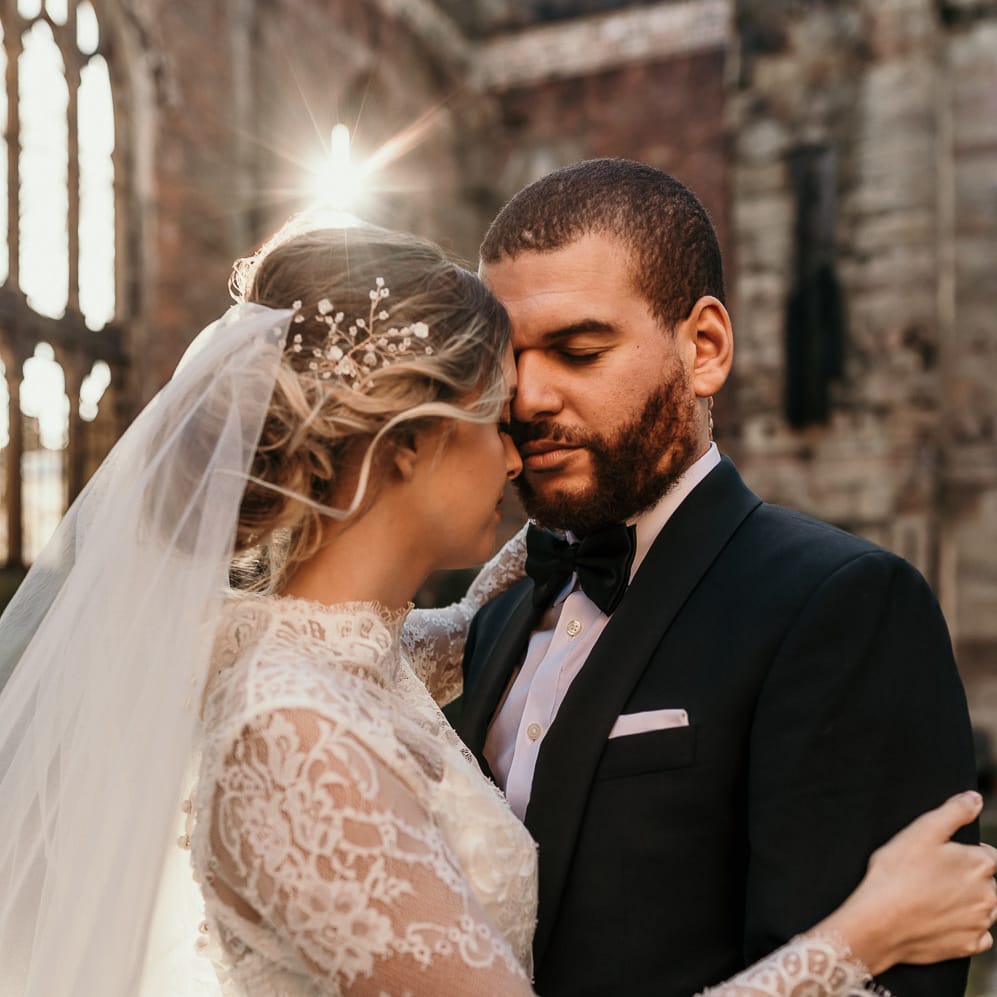 Bride with a classic updo, hair vine and wedding veil 