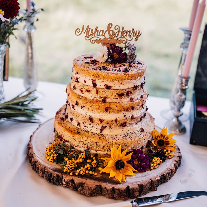 Rustic styled wedding cake complete with floral decoration