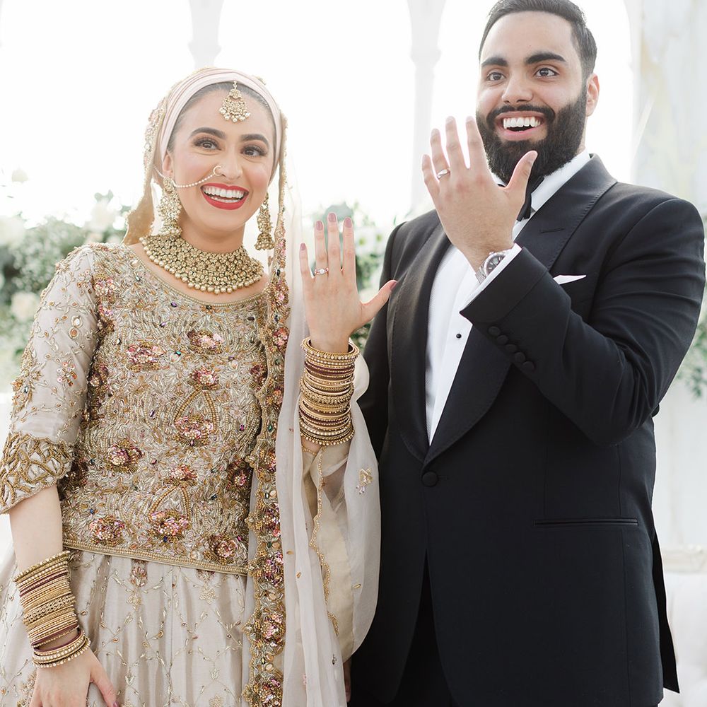 Bride & groom show off their wedding rings after Walima at the Isla Gladstone Conservatory