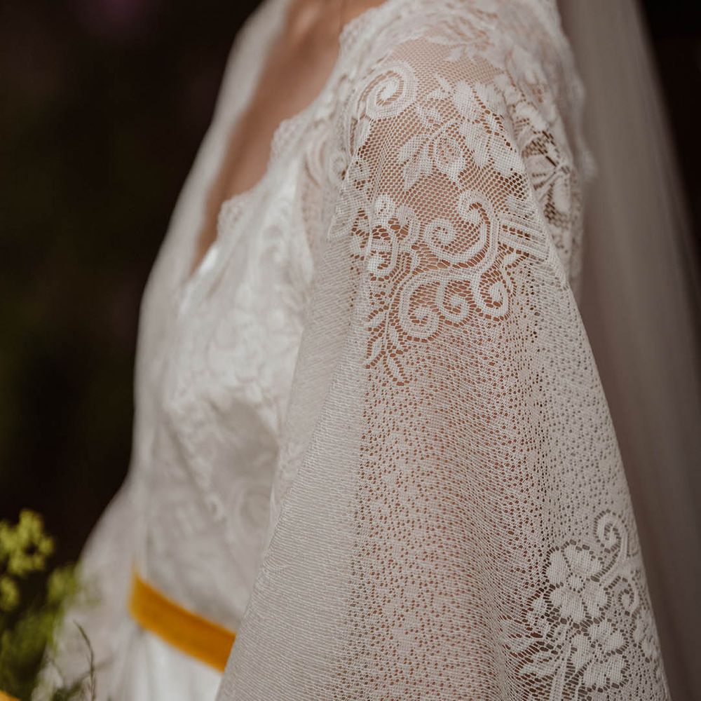 Detail on lace Kimono style wedding dress