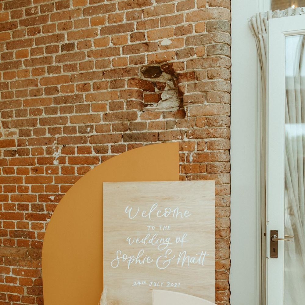 Orange and ivory welcome wedding sign with dried flower decoration 