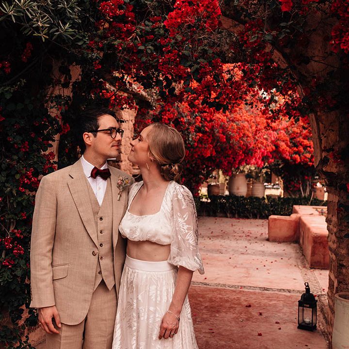 Bride and groom walk around the destination wedding venue, Beldi Country Club for their cute couple portraits 