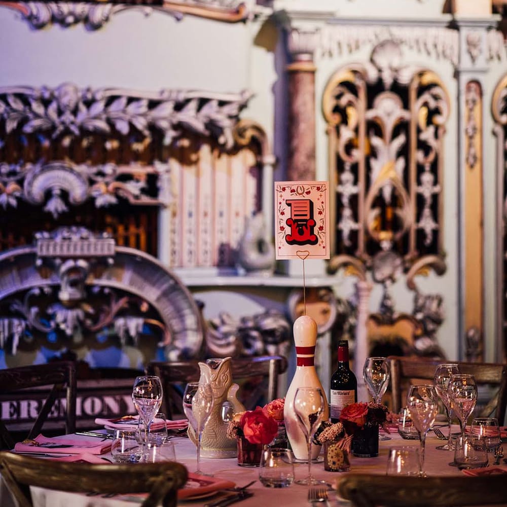 Bowling pin table centrepiece with table number sign 