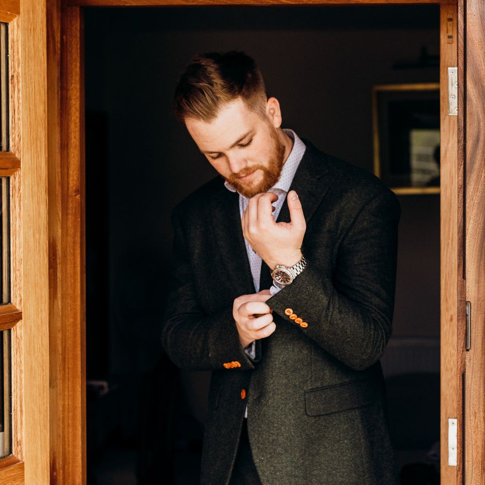Groom getting ready on wedding morning