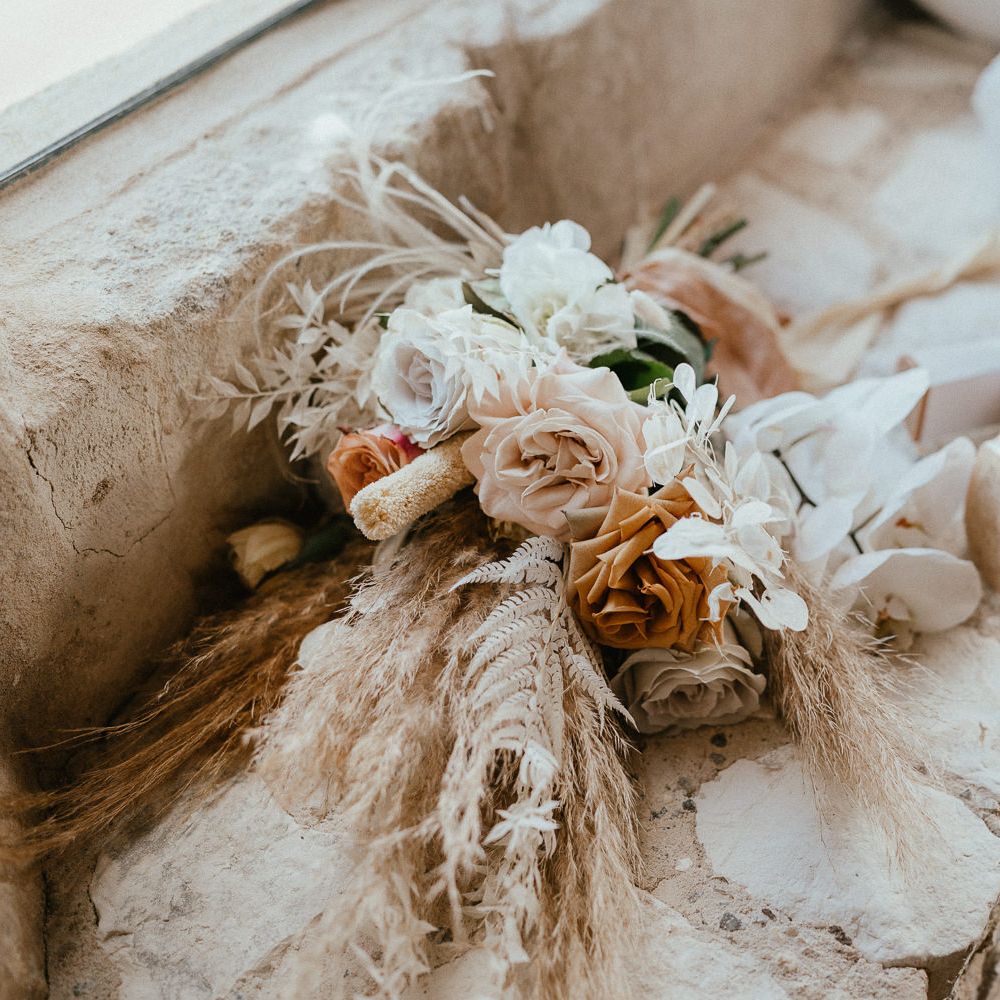 Dried and fresh wedding bouquet with orchids, twisted willow and frilly caramel toned garden roses