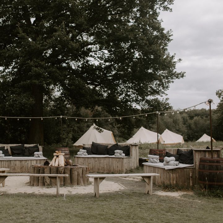Outdoor seating with rustic vibe and fire pit in the middle