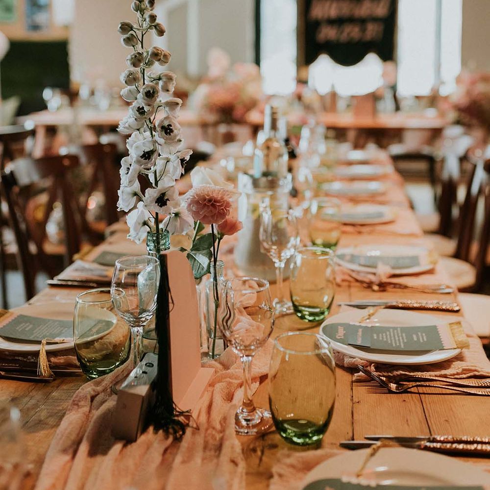 Rustic and retro tablescape complete with disposable cameras and pastel florals