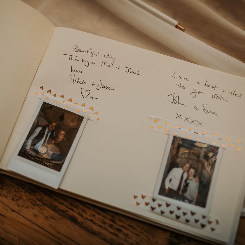 Guests messages in polaroid wedding guest book 