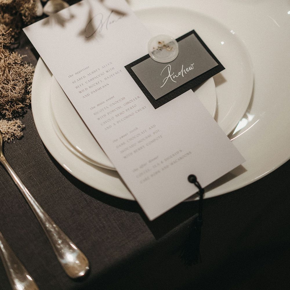 Elegant place setting with menu card and name tag with wax seal 