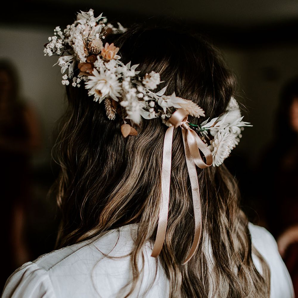 Floral bridal crown tied with pale pink ribbon 
