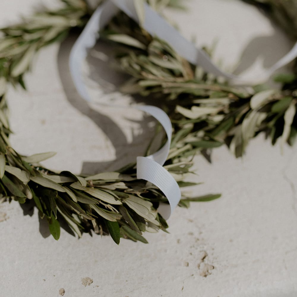 Olive leaf floral crowns for Stefana crowning tradition in wedding ceremony