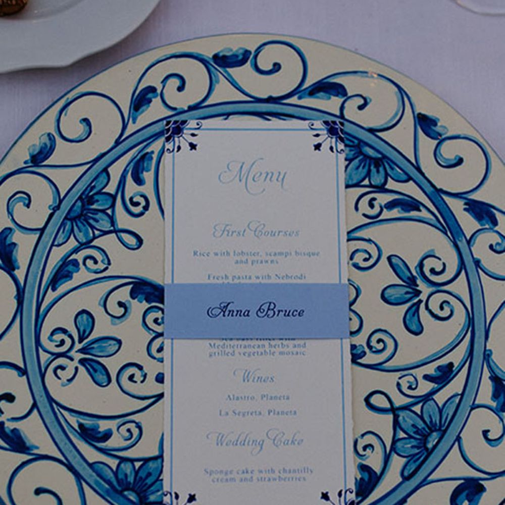 Blue and white patterned plates with blue and white wedding menu card 
