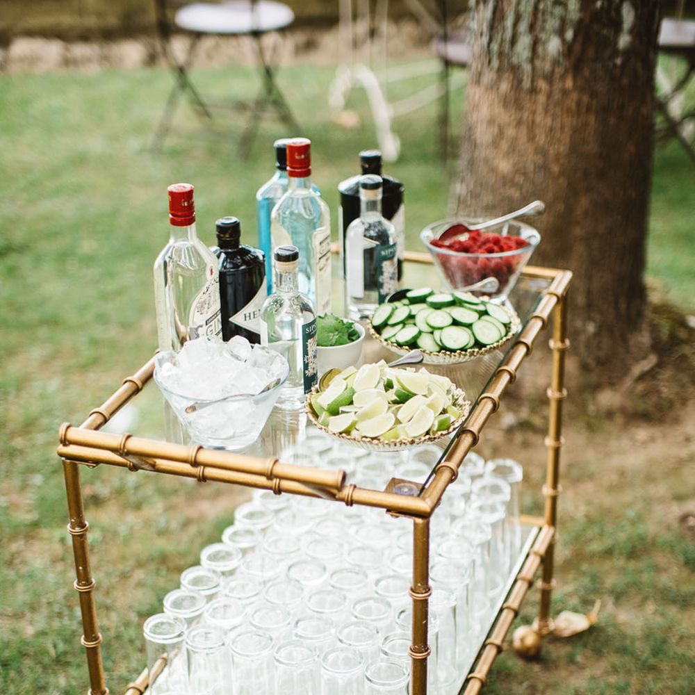 Pimp your drink station unique wedding bar design idea with cart filled with different garnishes, and ice for wedding guests 