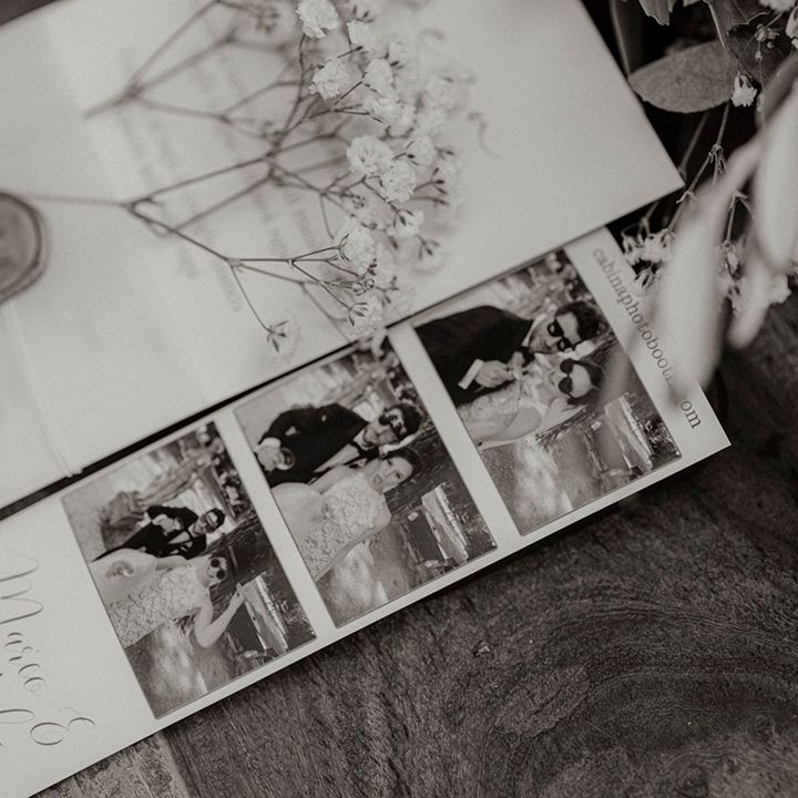 Classic white wedding stationery with vellum band and wax seal with photobooth picture of the bride and groom 