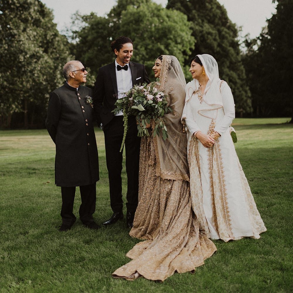Portrait of the bride and groom with the brides parents 