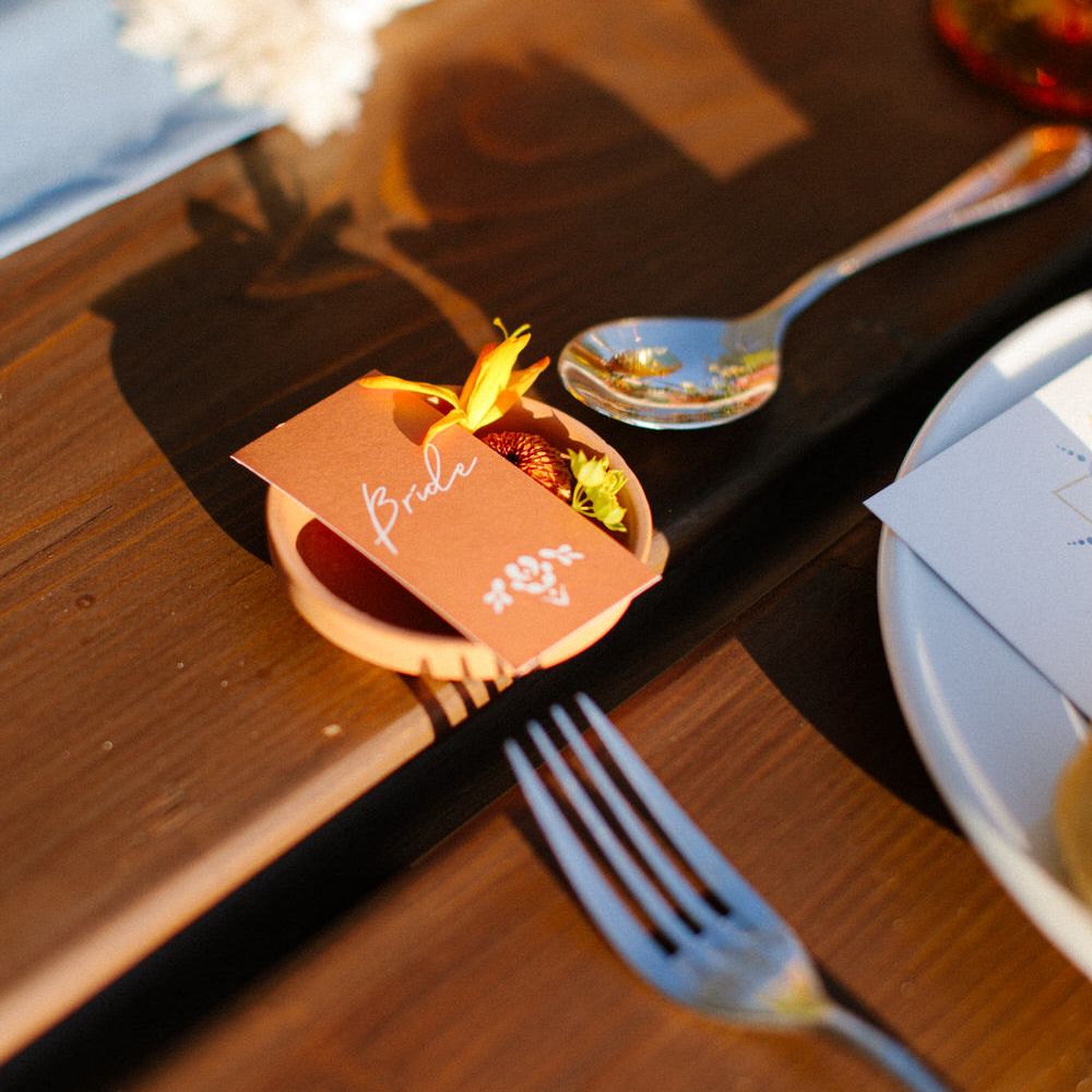 Terracotta plate and name label for a destination wedding in Greece