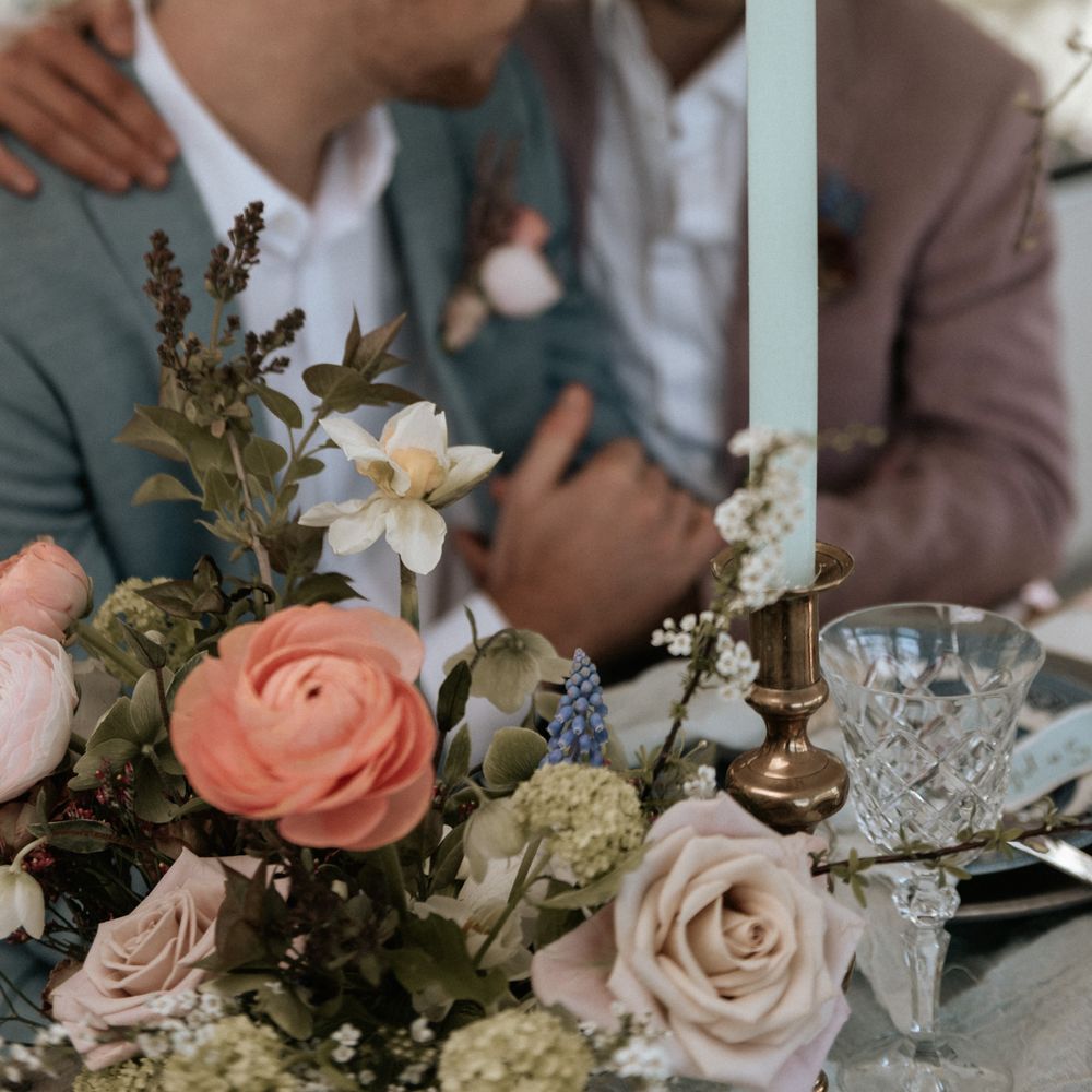 Pastel florals for rustic same sex wedding at The Fire Pit Camp 