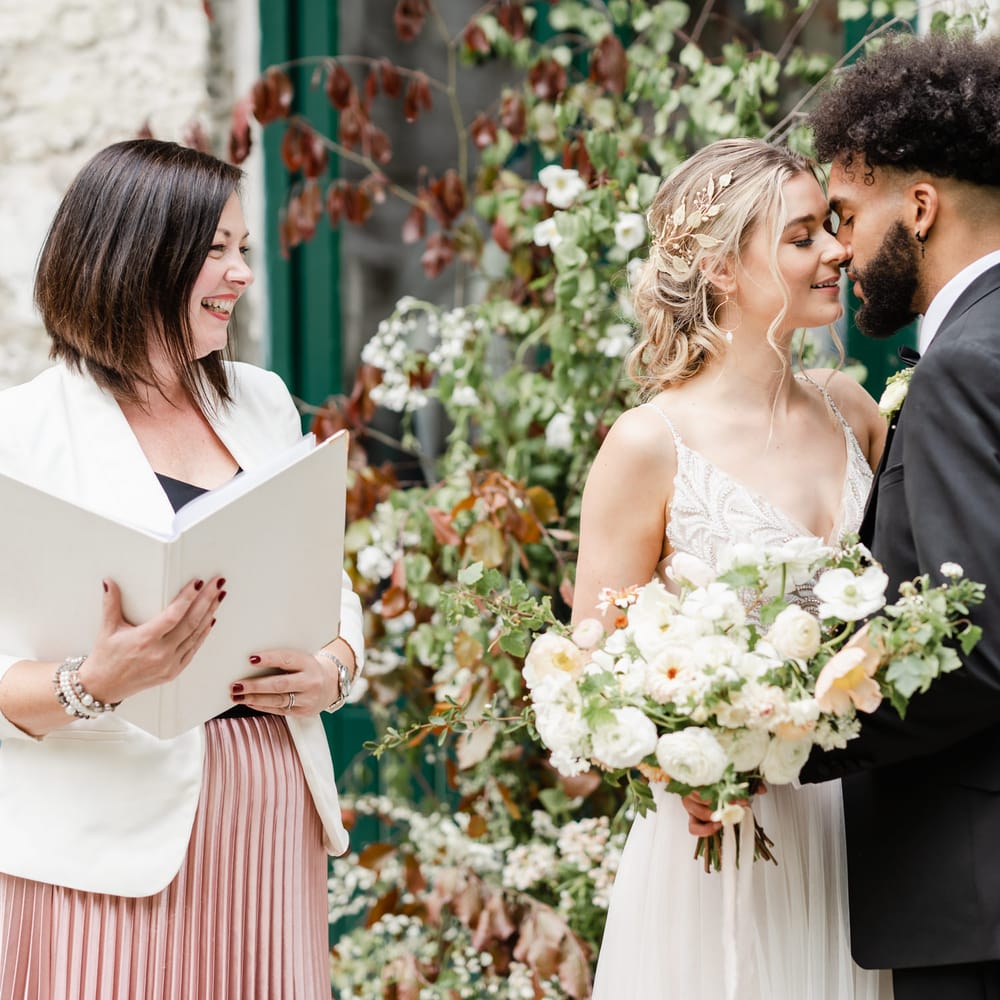 Wedding celebrant in pink please skirt at Torr Vale Mill wedding 