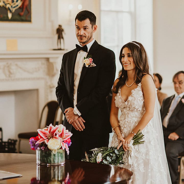 Bride & groom stand together during their wedding ceremony