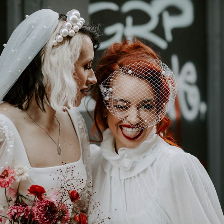 Two brides in a pearl headband and birdcage veil at Manchester elopement 