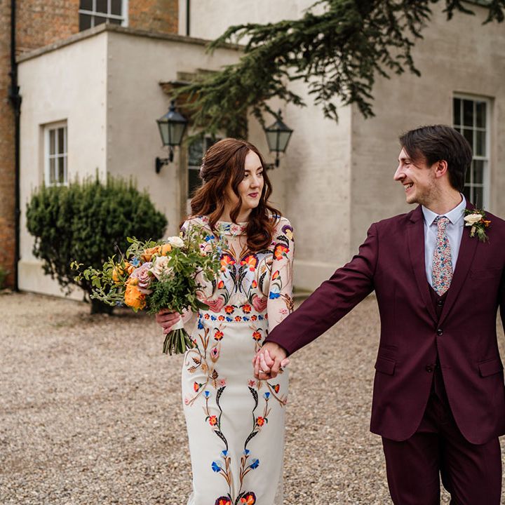 Bride and groom walk together around their wedding venue