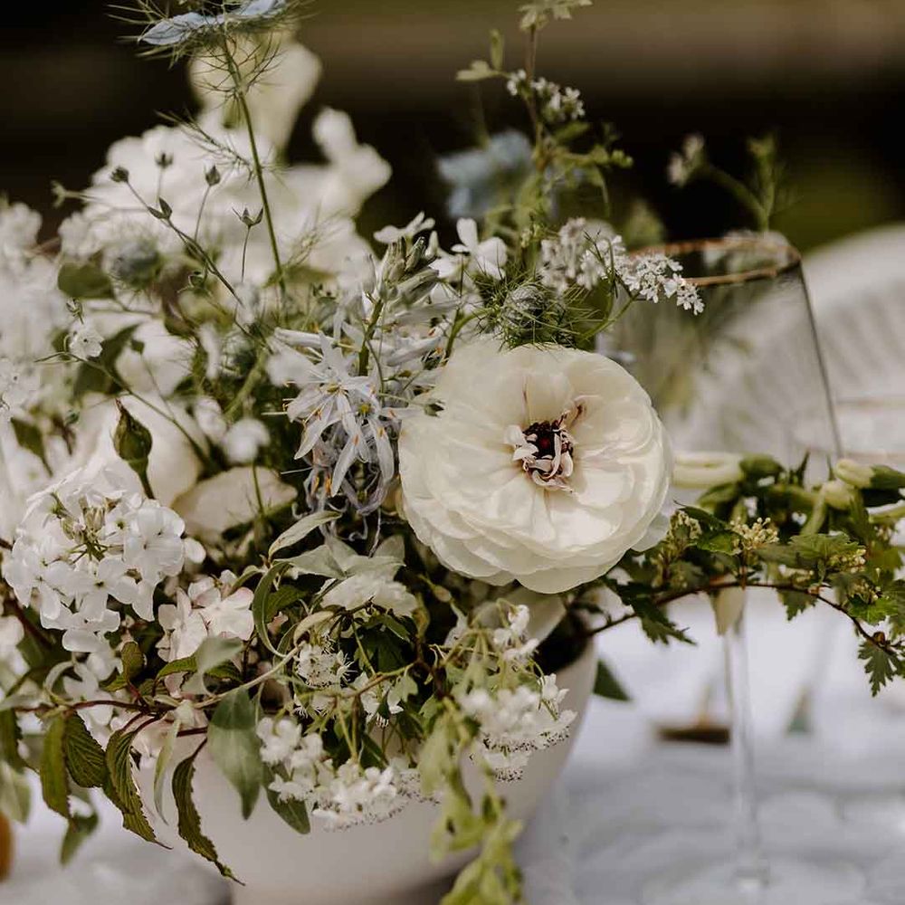 white wedding flower table decorations at Capesthorne Hall wedding