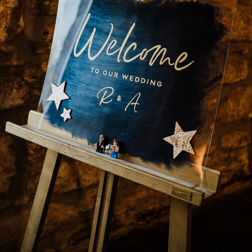 Metallic blue wedding welcome signage with stars for celestial wedding theme 
