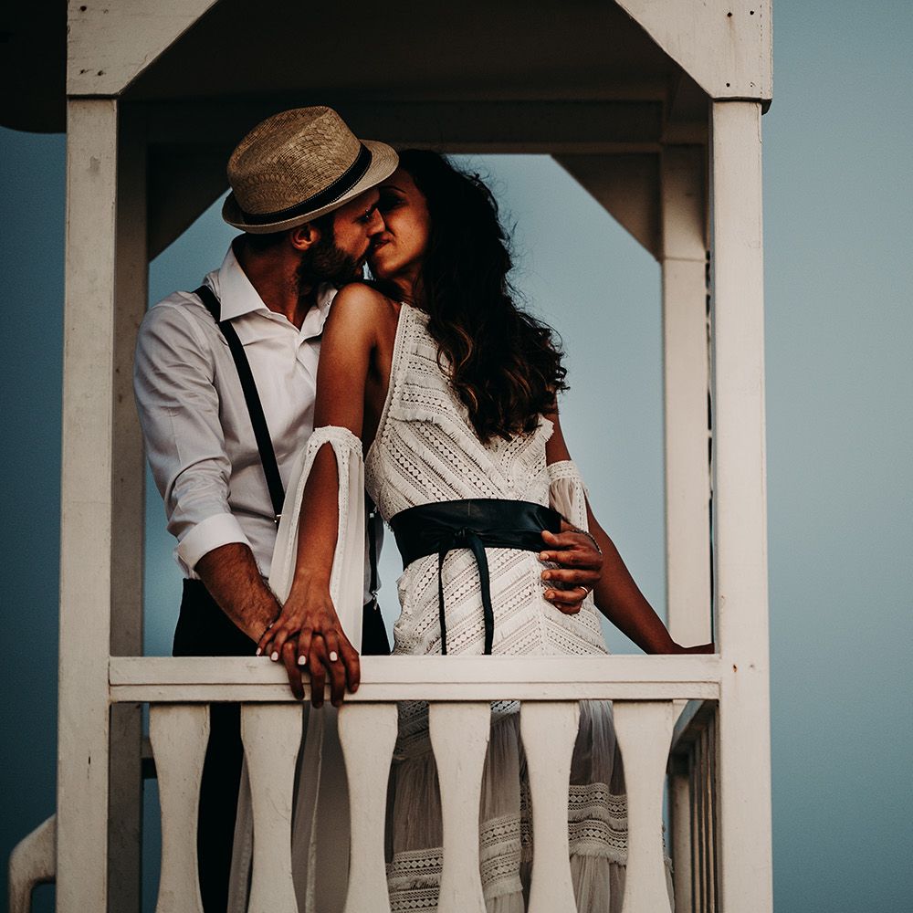 Bride and groom on beach at sunset at Puglia wedding