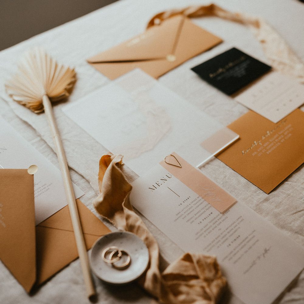 Vellum wedding stationery designs with gold foil typography 
