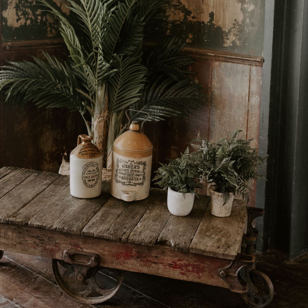 Rustic setting complete with jars filled with green foliage