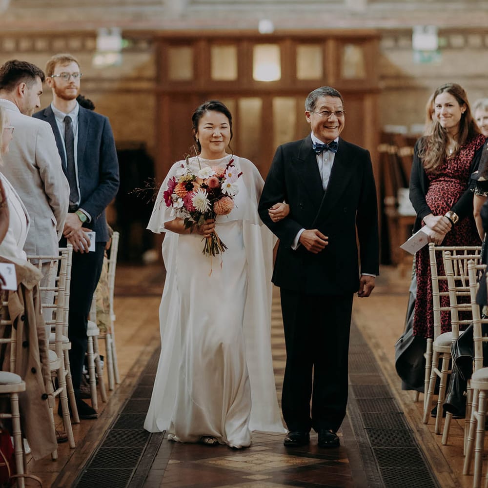 Bride walks down the aisle with her father  | Irene Yap Photography