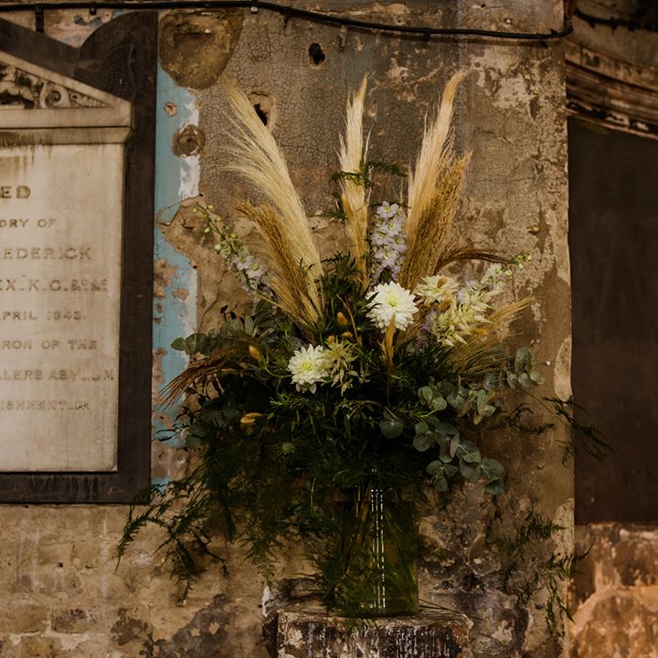 Wedding flowers made up of dried pampas grass and fresh greenery at city wedding