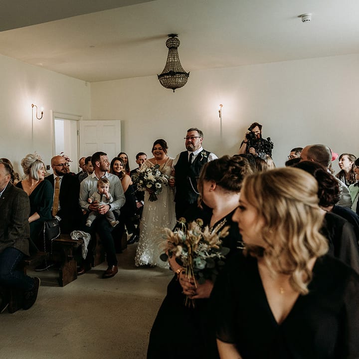 Aswarby Rectory wedding venue with guests watching the wedding of Jess and Jake