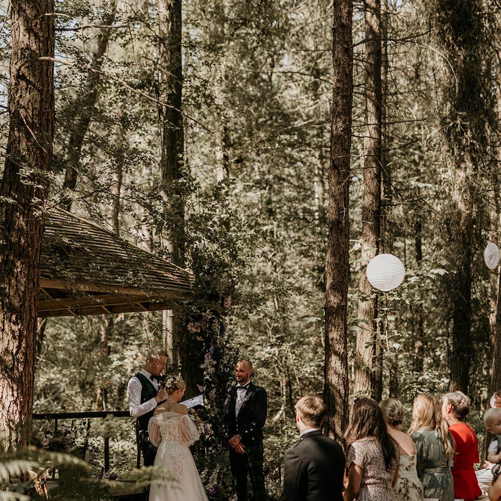 Humanist wedding ceremony at Camp Katur wedding venue with white paper lanterns 