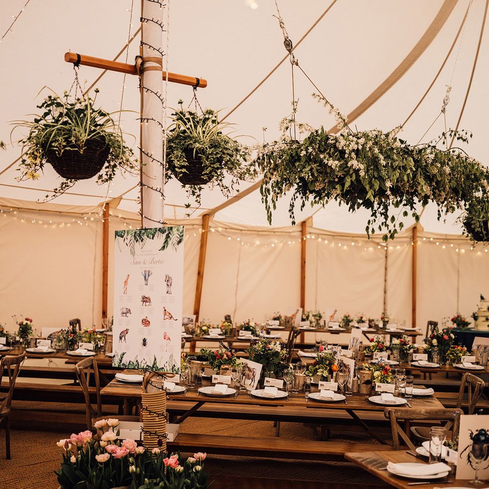 Foliage decorations at marquee wedding at home with tulips for spring wedding 