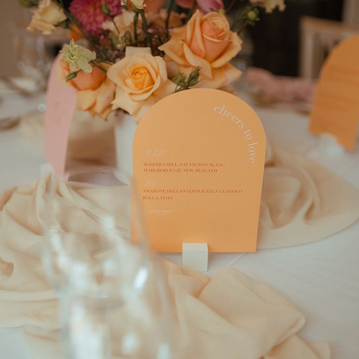 Orange arched wedding sign for the wine list at the wedding