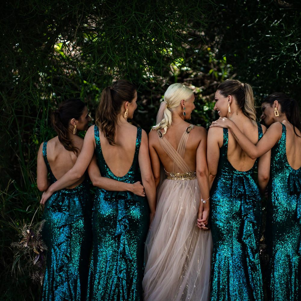 Scoop back bridesmaid dresses in emerald green sequins
