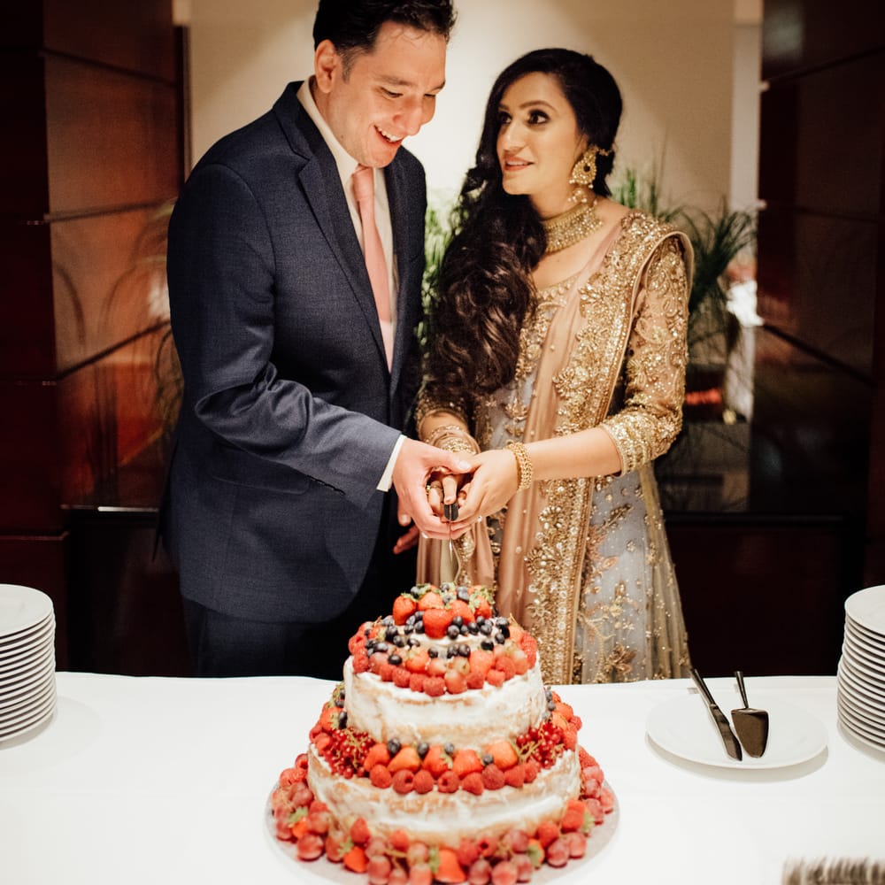 Bride & groom cut wedding cake