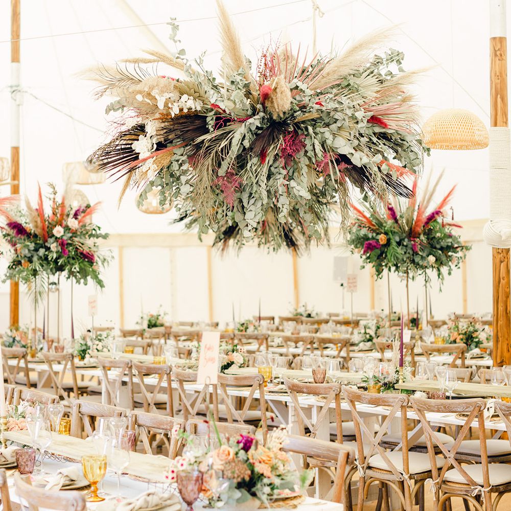 Foliage and flower installations with pampas grass decor