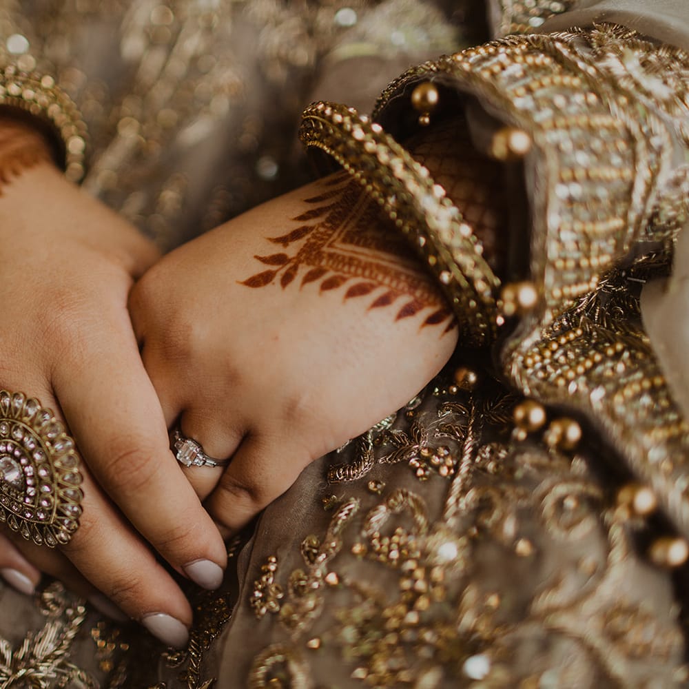 Muslim bride with henna and gold jewellery 