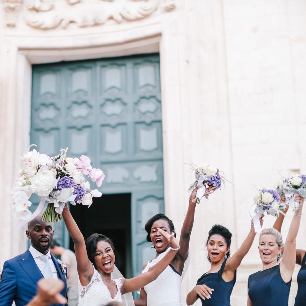 Wedding party celebrating with purple, pink and purple wedding theme and Midnight blue bridesmaid dresses
