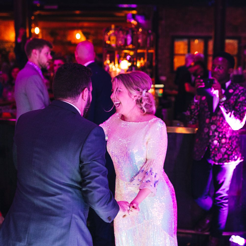 Bride & groom dance together during their reception