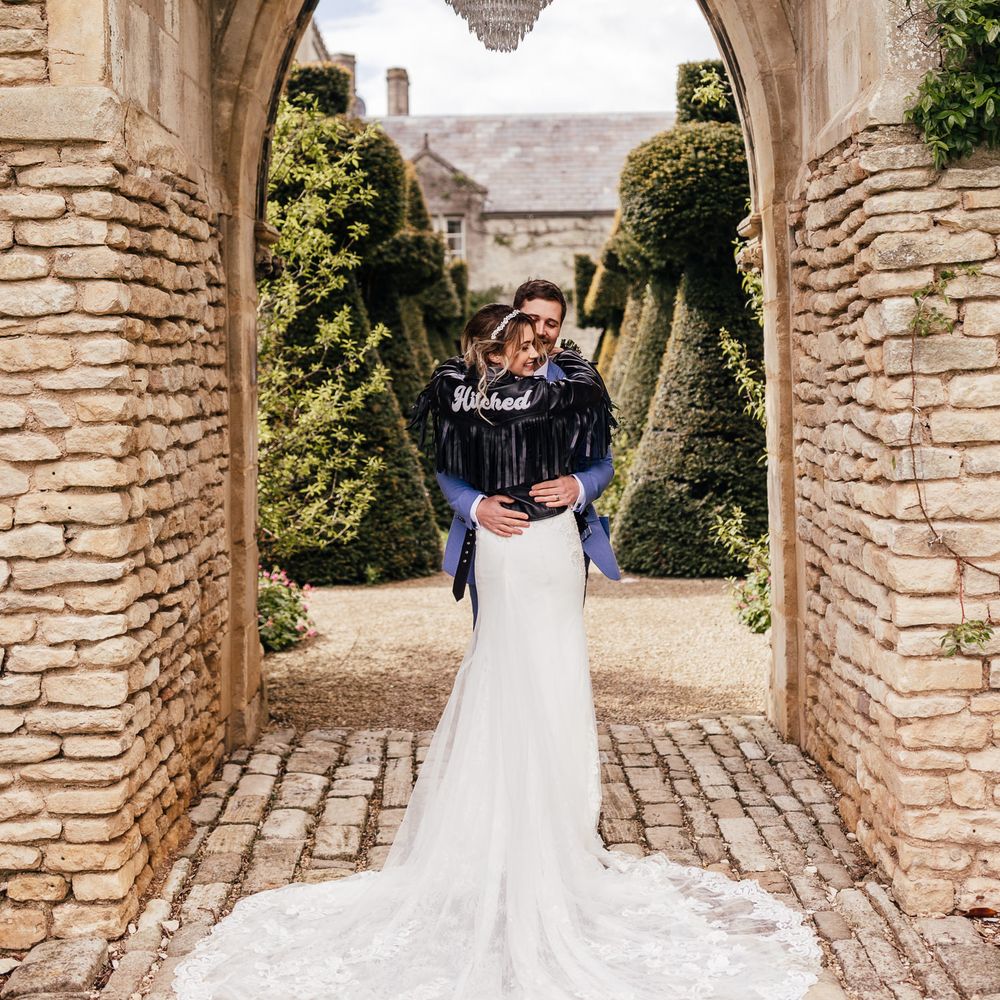 Bride wears leather jacket on her wedding day