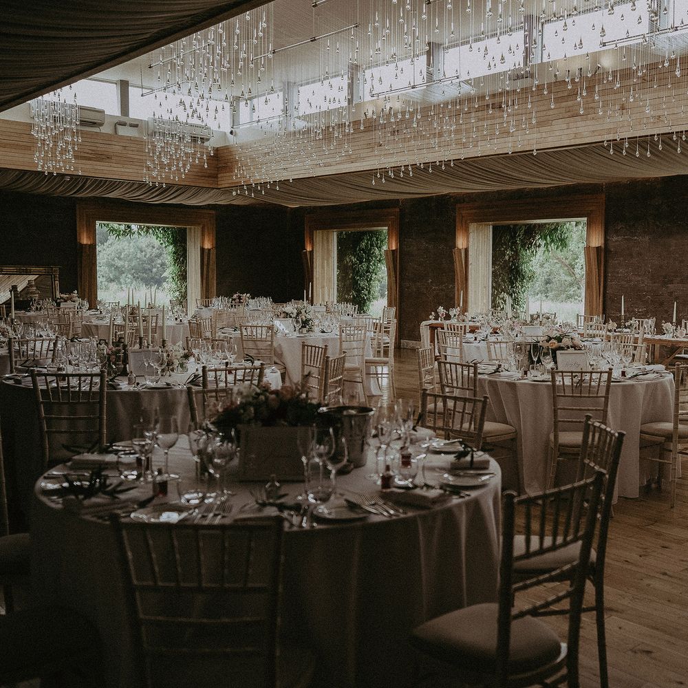 Elmore Court reception room complete with hanging lights and gold chairs
