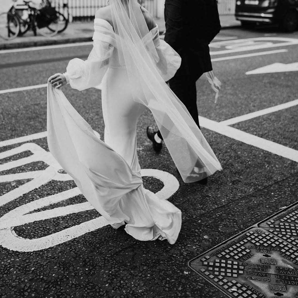 Brides Vale hangs as she holds hands with Groom across Chelsea road 