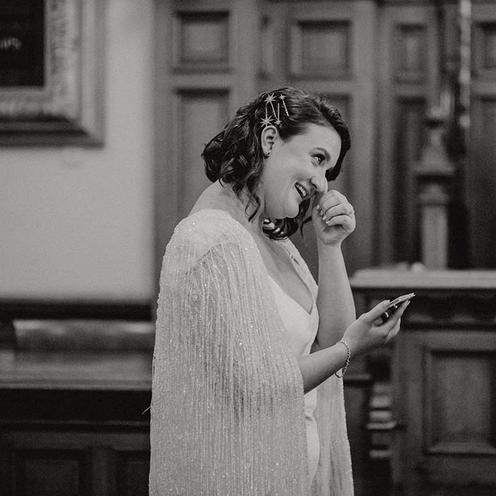 Bride becomes emotional on her wedding day in black & white image