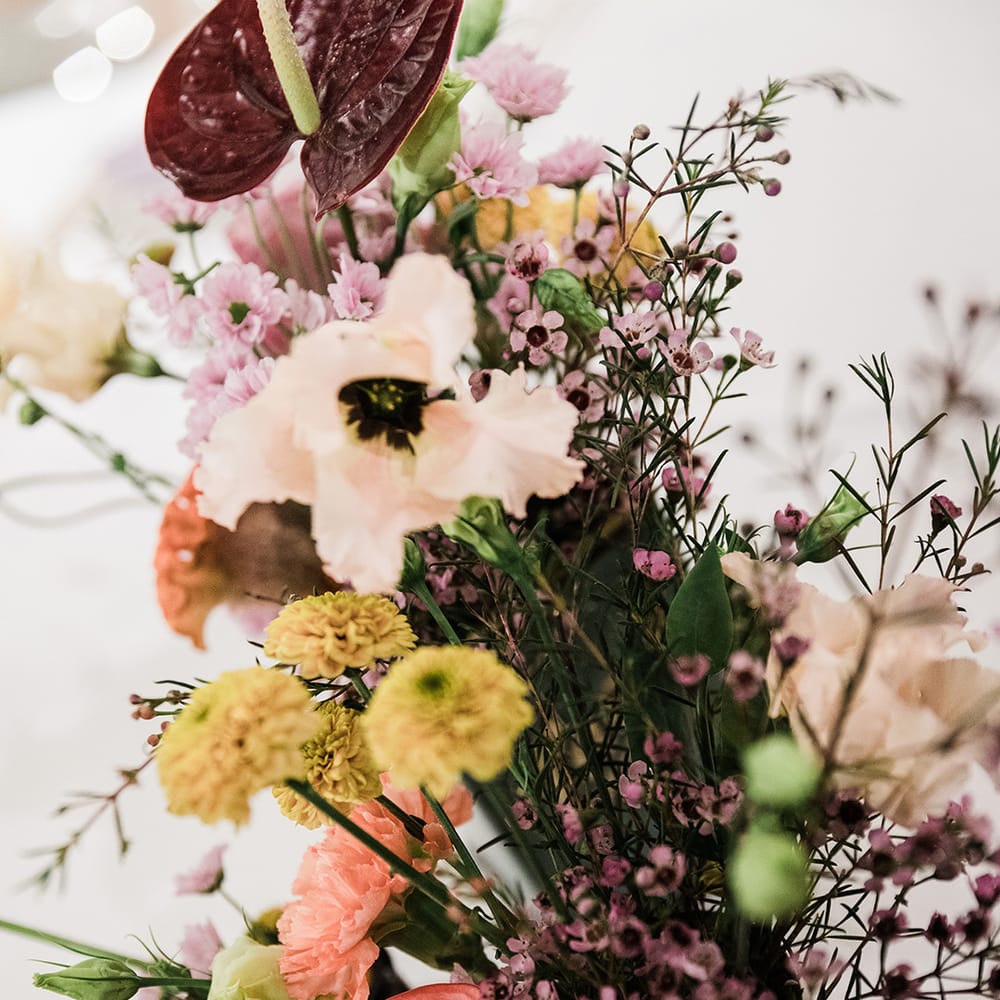Wedding flowers of pinks and reds in tin can 