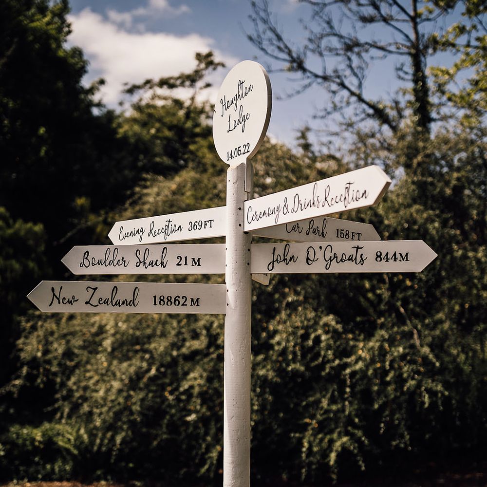 Houghton lodge white direction sign 