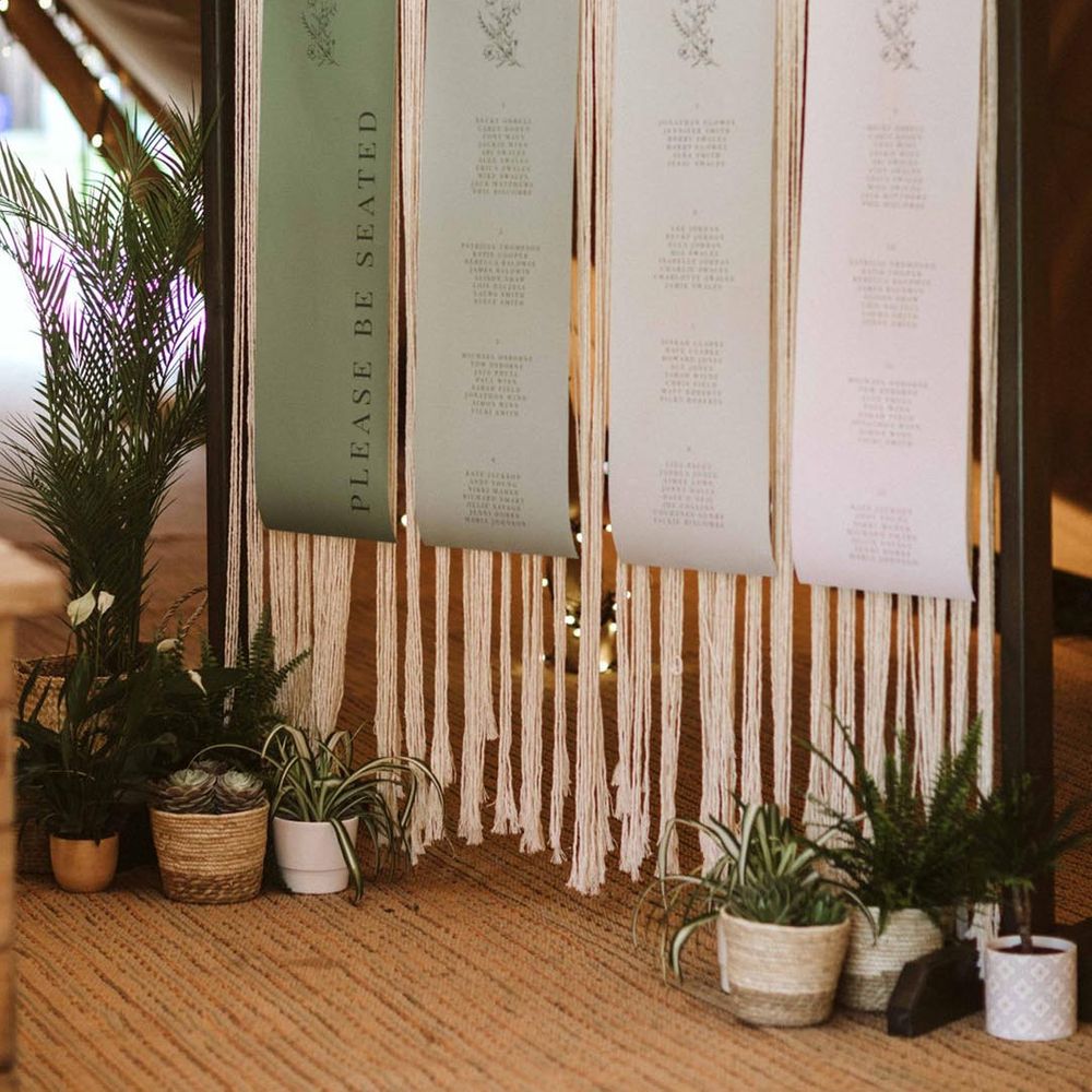 Green ombre hanging seating chart with macrame wedding sign